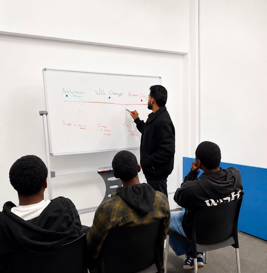 Yovesh leading an AI enablement session at the whiteboard